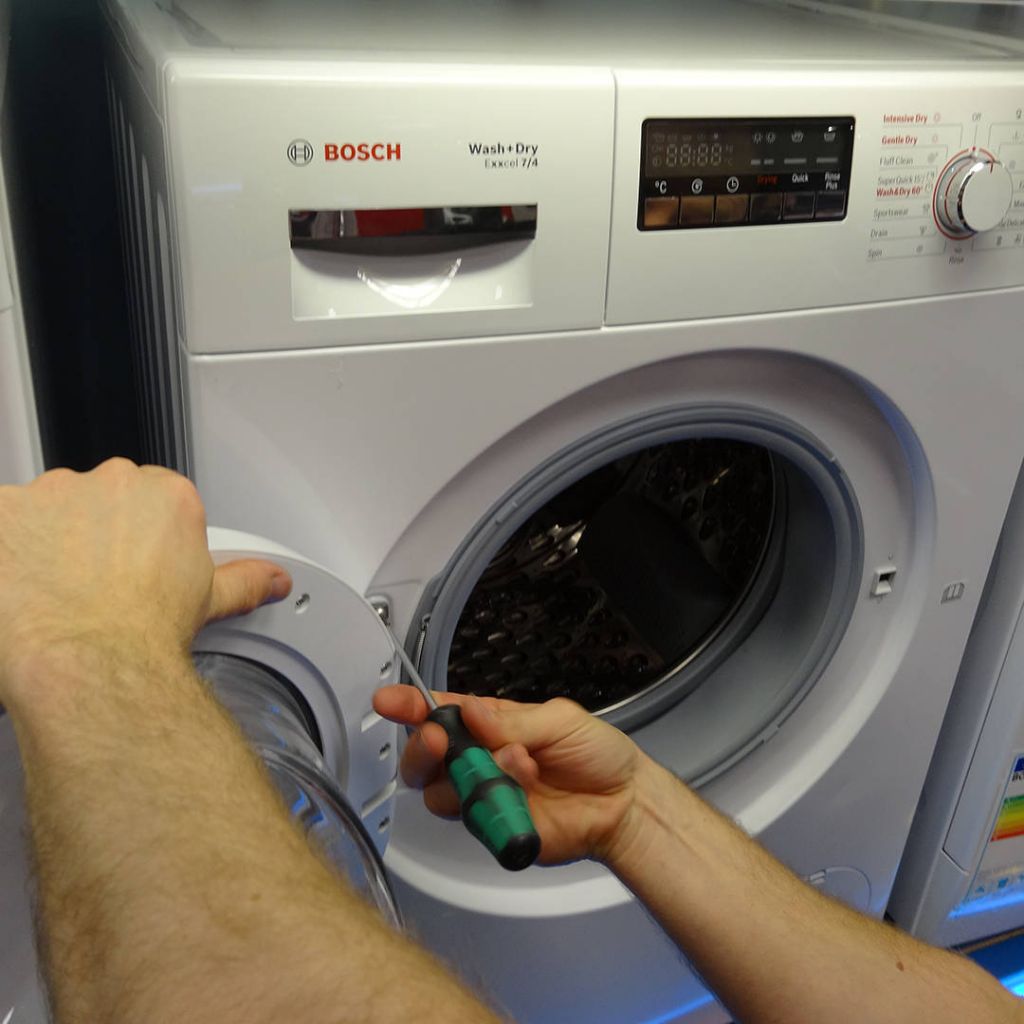 Bosch washing machine being repaired by Snellings Repair engineer